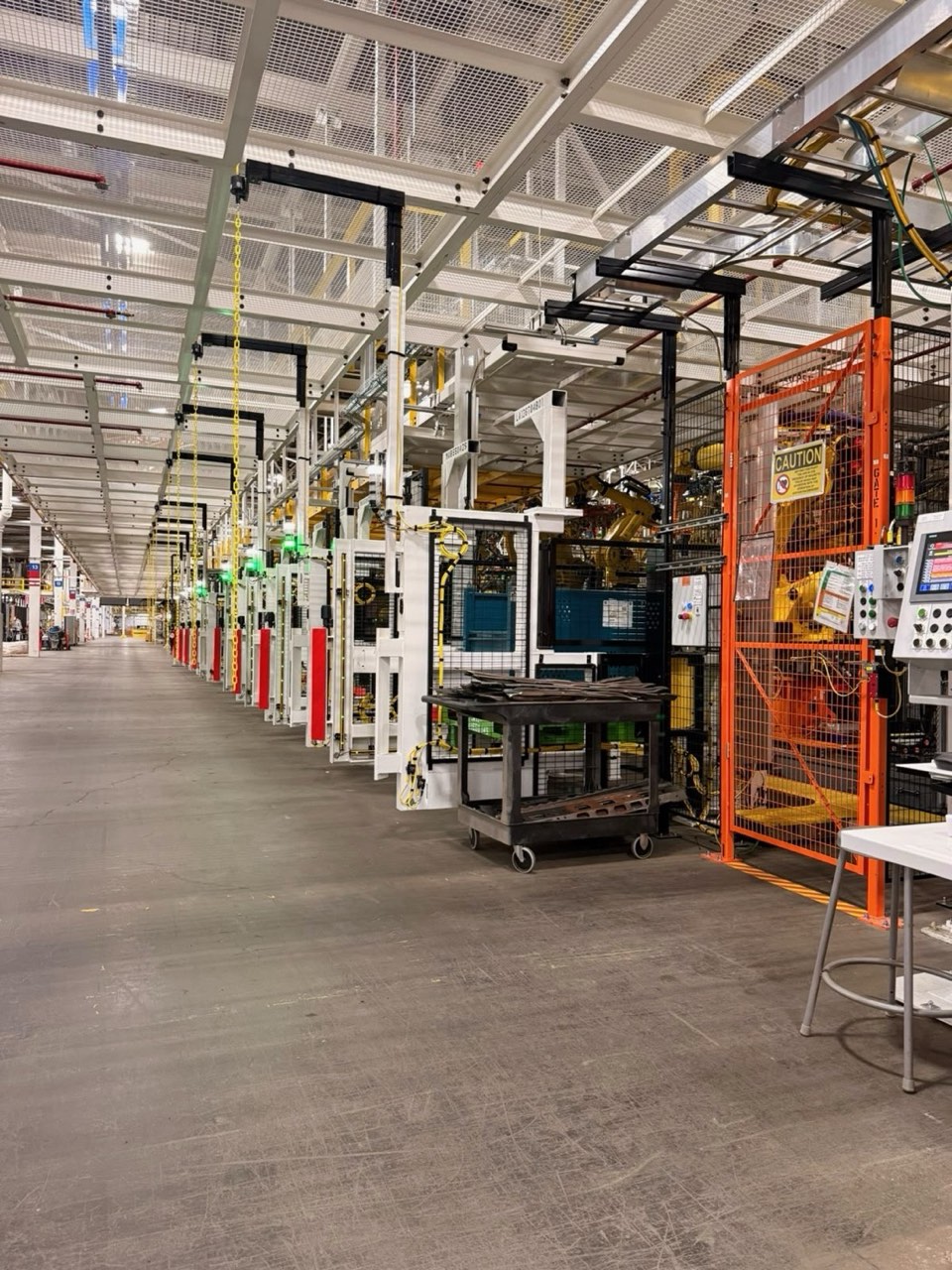 Row of automated cells on a production floor