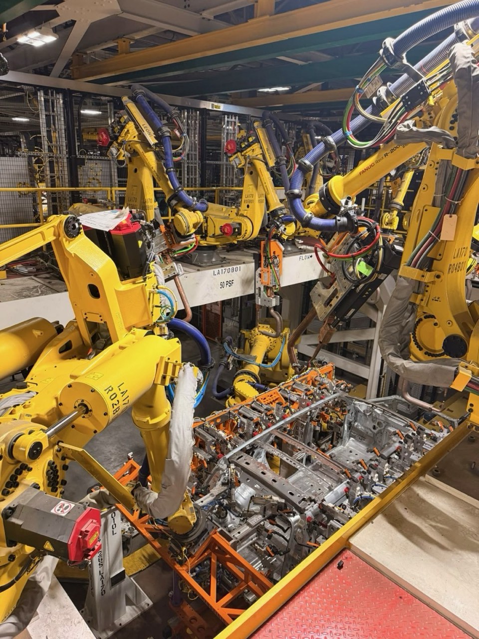 Robotic welding cell on an automotive body line